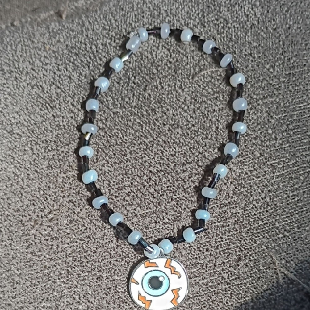 Elegant Beaded Necklace with Eye Pendant